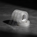 Trust Tape 2.0 - three rolls on dark concrete background